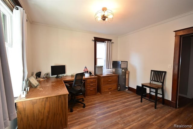 office area with baseboards, crown molding, and wood finished floors