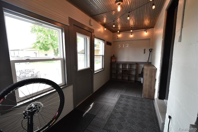 entryway with track lighting and wooden ceiling