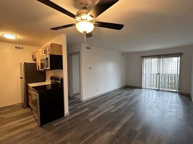 8741 Green Willow St Unit 11, Brighton, MI 48116 - kitchen with stainless steel appliances, dark wood-type flooring, ceiling fan, and baseboards