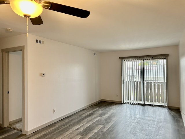 8741 Green Willow St Unit 11, Brighton, MI 48116 - empty room featuring wood finished floors, ceiling fan, a smoke detector, and baseboards
