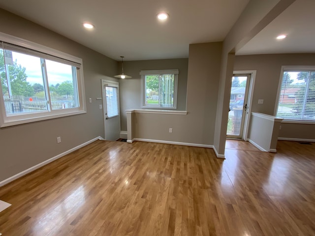 interior space with light wood finished floors, baseboards, and recessed lighting