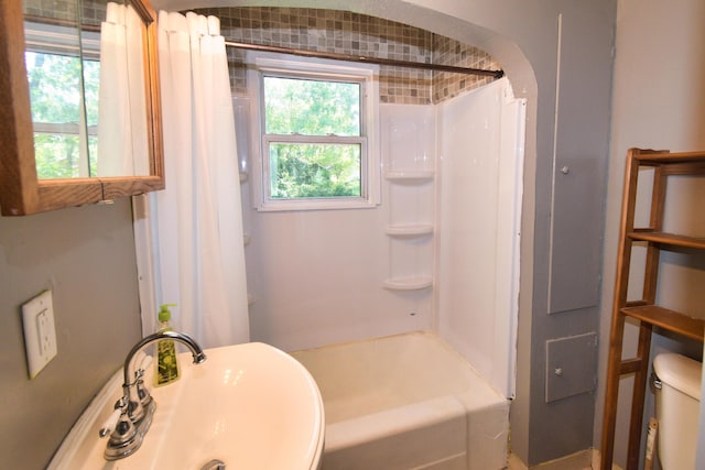 full bath featuring toilet and a sink