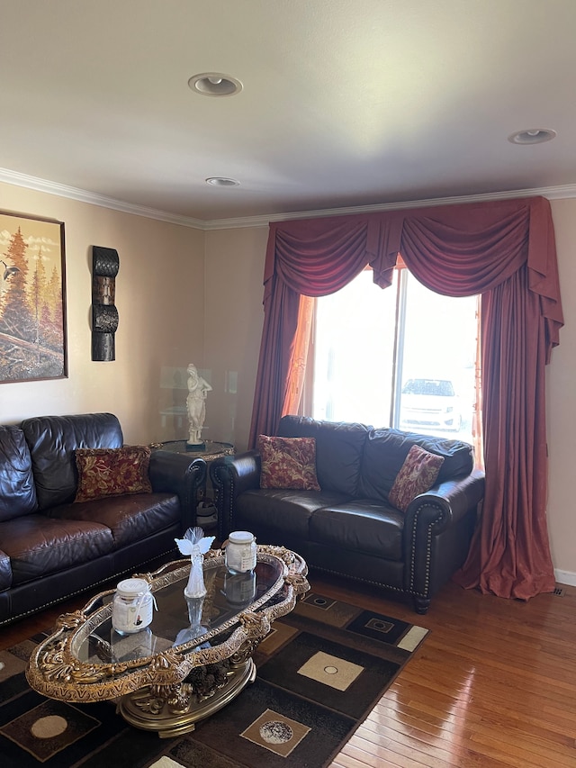 living room with wood-type flooring, recessed lighting, and crown molding