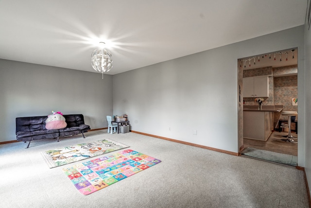 game room with carpet flooring and baseboards