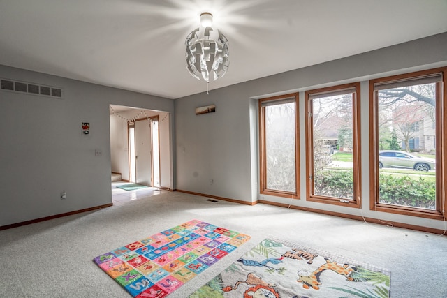 interior space with visible vents and baseboards