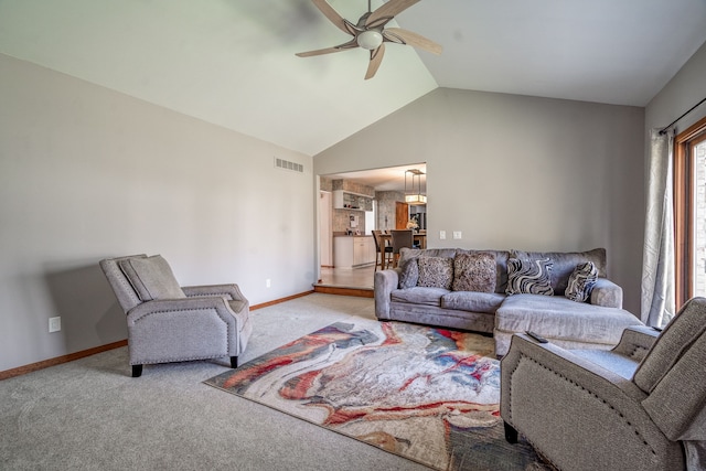 carpeted living room featuring high vaulted ceiling, ceiling fan, baseboards, and visible vents