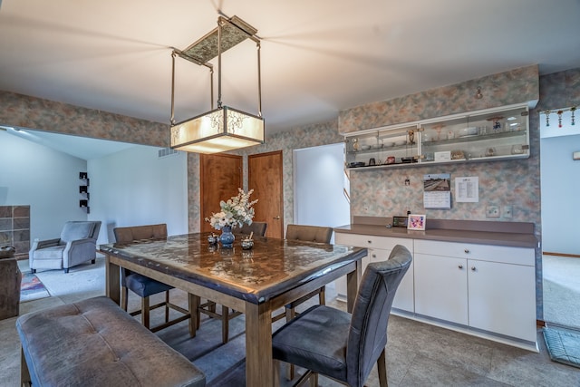 dining room with wallpapered walls