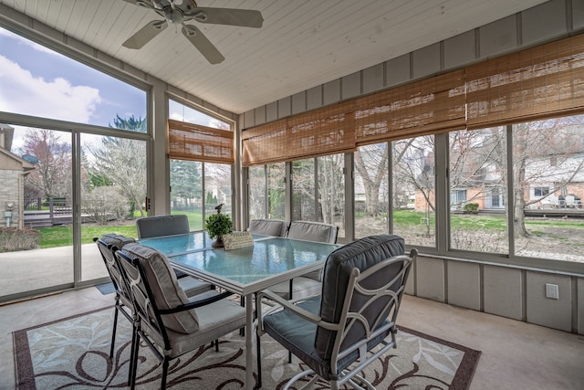 sunroom / solarium featuring ceiling fan and outdoor dining space