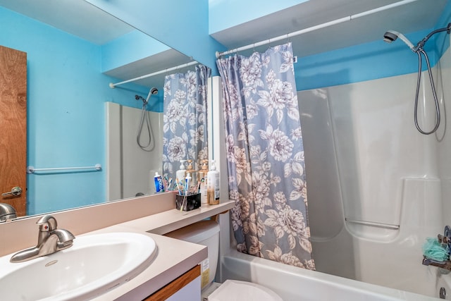 bathroom with shower / bath combination with curtain, toilet, and vanity