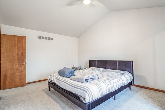 bedroom featuring vaulted ceiling, baseboards, visible vents, carpet, and a ceiling fan