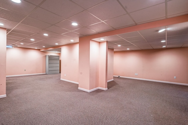 finished below grade area featuring baseboards, carpet flooring, a paneled ceiling, and recessed lighting
