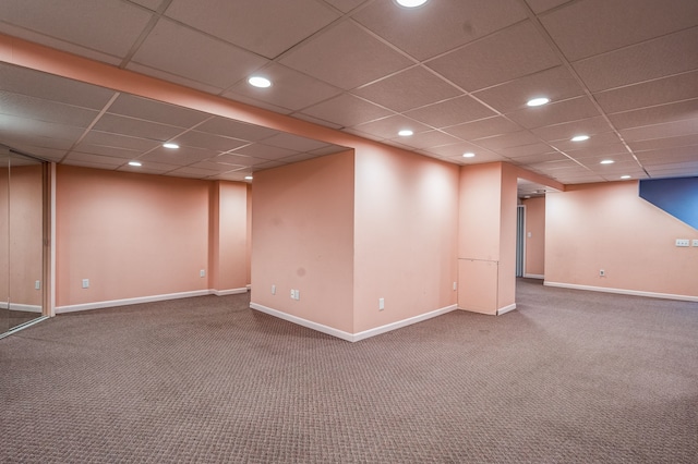 finished below grade area featuring carpet floors, a drop ceiling, and recessed lighting