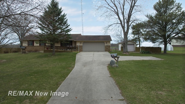 ranch-style home with concrete driveway, an attached garage, brick siding, and a front lawn