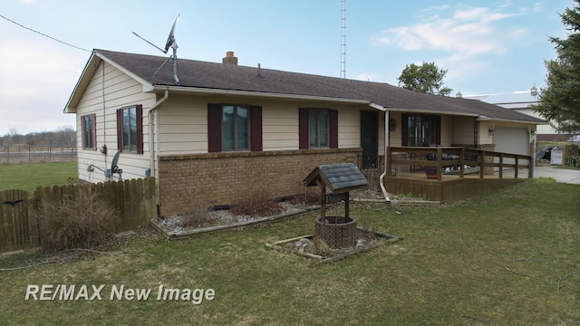 exterior space with a garage, a yard, fence, a chimney, and concrete driveway