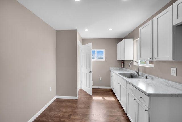 12751 Rosemary Blvd, Oak Park, MI 48237 - kitchen featuring a sink, light countertops, baseboards, and white cabinets