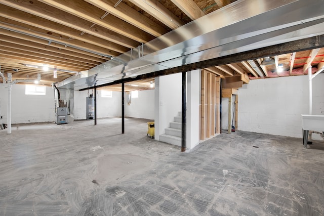 12751 Rosemary Blvd, Oak Park, MI 48237 - below grade area featuring water heater, stairway, and heating unit