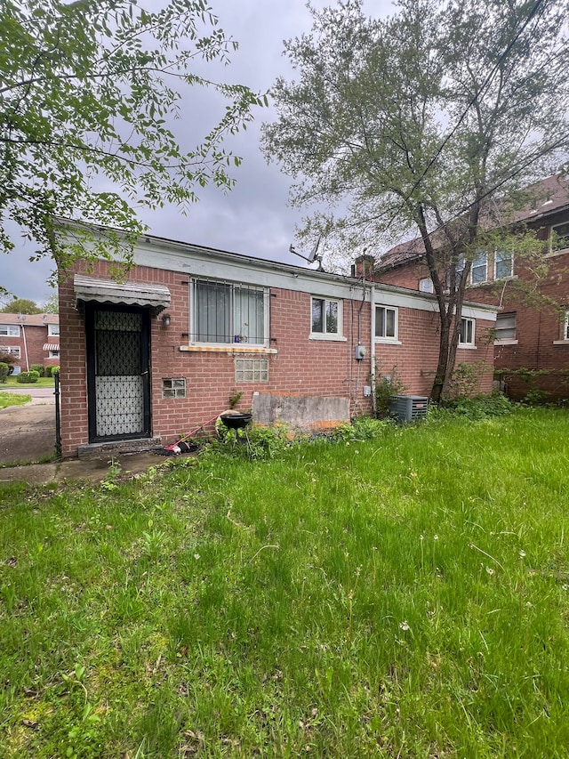 16200 Lawton St, Detroit, MI 48221 - back of house with brick siding and central AC