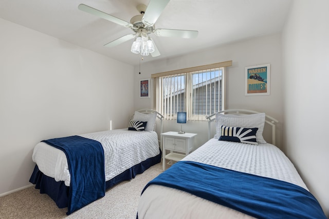bedroom with a ceiling fan and carpet
