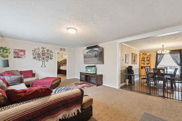 carpeted living area featuring crown molding, a textured ceiling, visible vents, baseboards, and a notable chandelier