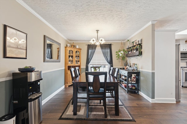 dining space with baseboards, an inviting chandelier, and dark wood finished floors