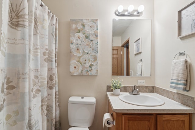 full bath with toilet and vanity