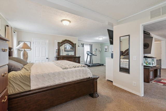 bedroom featuring baseboards, ornamental molding, a textured ceiling, carpet floors, and visible vents
