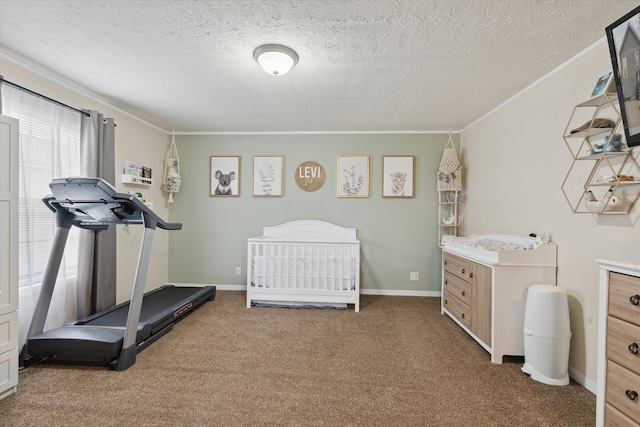 carpeted bedroom with ornamental molding, baseboards, and a textured ceiling