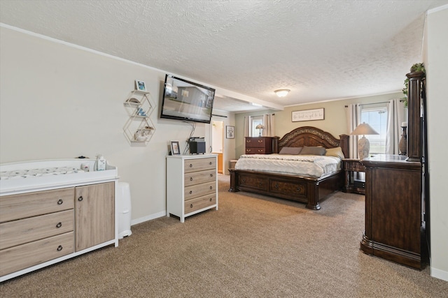 bedroom featuring a textured ceiling, baseboards, and carpet