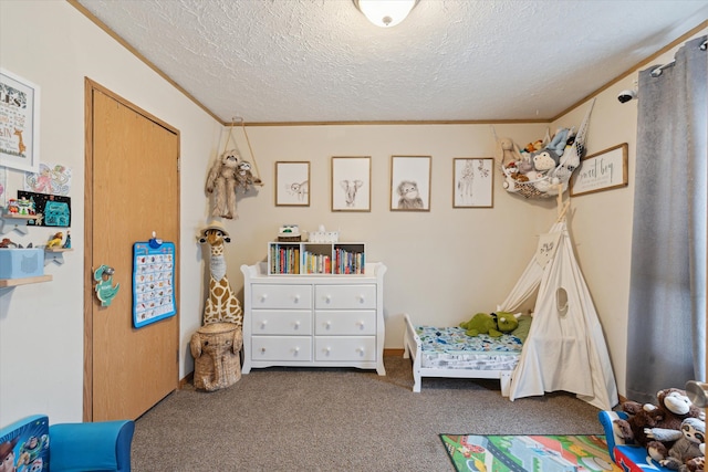 rec room with crown molding, carpet, and a textured ceiling