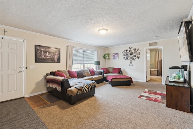 carpeted living room featuring baseboards, visible vents, a textured ceiling, and crown molding