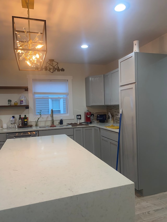 4519 Washington St, Wayne, MI 48184 - kitchen featuring stainless steel appliances, a sink, recessed lighting, light stone counters, and gray cabinets
