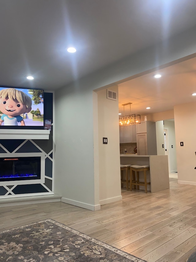 4519 Washington St, Wayne, MI 48184 - unfurnished living room with baseboards, visible vents, recessed lighting, and light wood-style floors