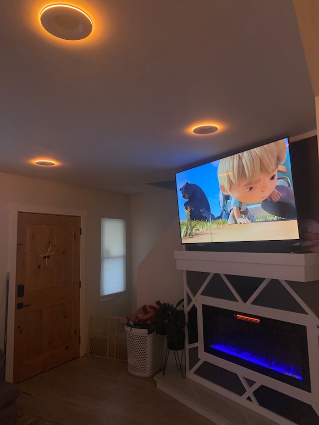 4519 Washington St, Wayne, MI 48184 - living room featuring a warm lit fireplace and wood finished floors