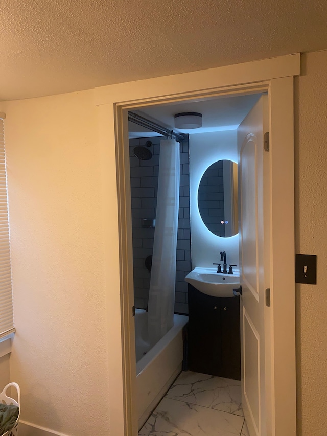 4519 Washington St, Wayne, MI 48184 - full bath with shower / tub combo, marble finish floor, a sink, and a textured ceiling