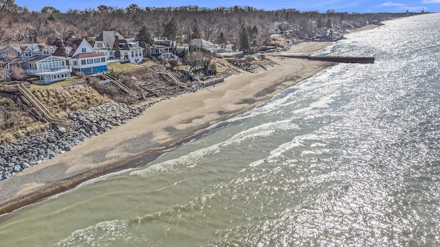 drone / aerial view with a water view and a residential view