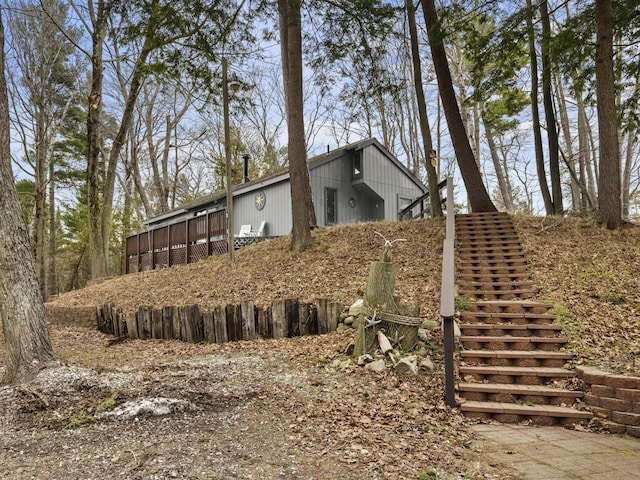 view of side of home featuring a wooden deck