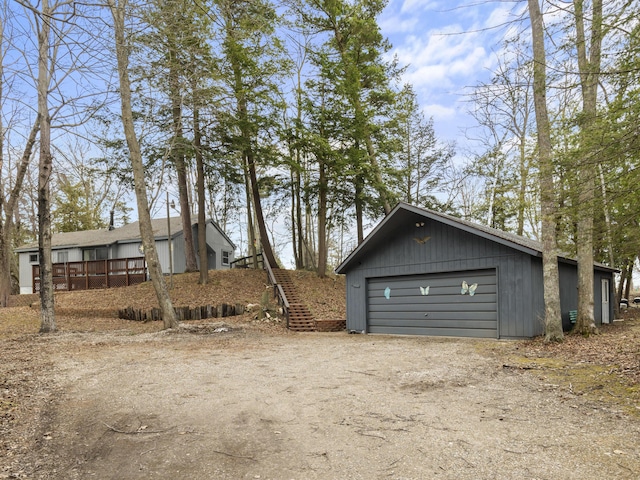 exterior space featuring an outbuilding and a detached garage