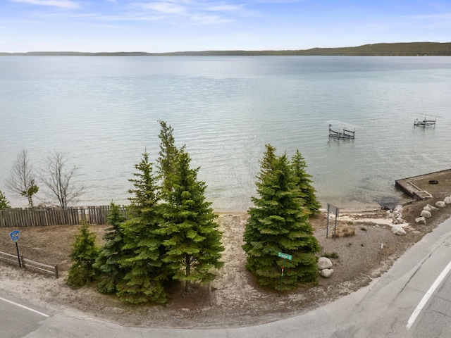 view of water feature with fence