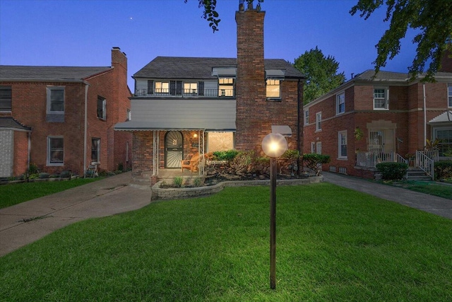 18468 Santa Barbara Dr, Detroit, MI 48221 - view of front of property with brick siding, a chimney, and a front lawn