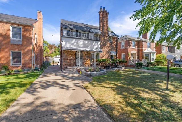 18468 Santa Barbara Dr, Detroit, MI 48221 - view of front of property with covered porch, a front yard, brick siding, a chimney, and a balcony
