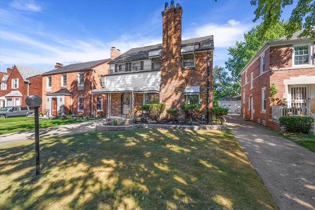 18468 Santa Barbara Dr, Detroit, MI 48221 - view of property with a chimney, a front yard, a residential view, and brick siding