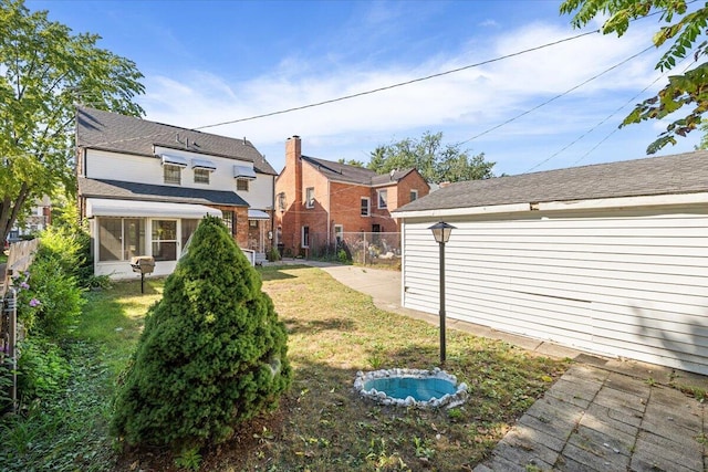 18468 Santa Barbara Dr, Detroit, MI 48221 - view of yard featuring a sunroom and fence