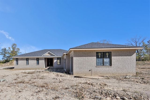 view of front of home with brick siding