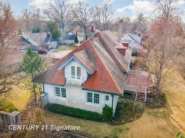 105 Parkwood Ct, Bay City, MI 48706 - exterior space with french doors, a chimney, a residential view, and stucco siding