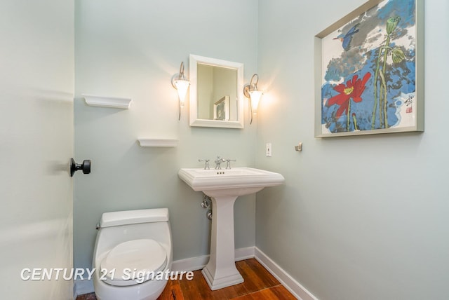 105 Parkwood Ct, Bay City, MI 48706 - bathroom with toilet, baseboards, and wood finished floors