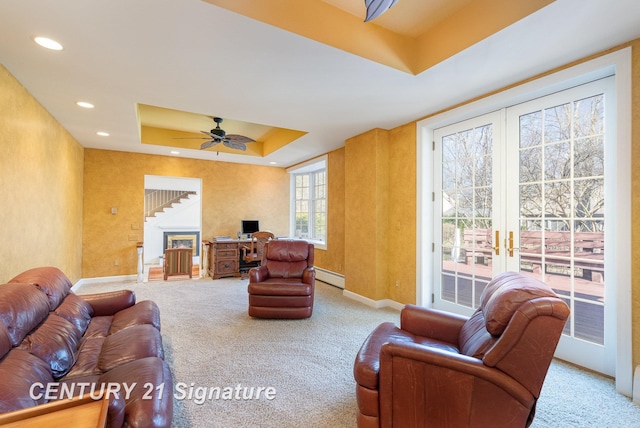 105 Parkwood Ct, Bay City, MI 48706 - living room with baseboards, carpet flooring, french doors, a raised ceiling, and a baseboard radiator