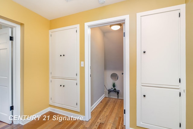 105 Parkwood Ct, Bay City, MI 48706 - corridor with light wood-style flooring and baseboards