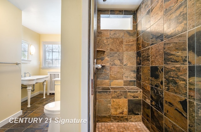 105 Parkwood Ct, Bay City, MI 48706 - bathroom with radiator, tiled shower, stone tile flooring, and toilet