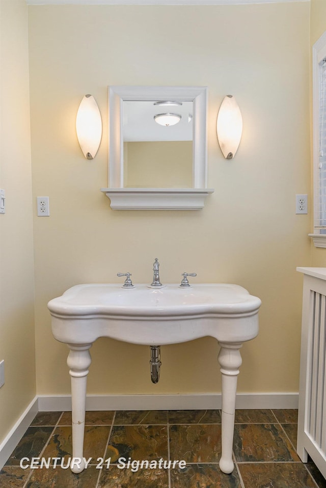 105 Parkwood Ct, Bay City, MI 48706 - bathroom with baseboards and stone finish flooring
