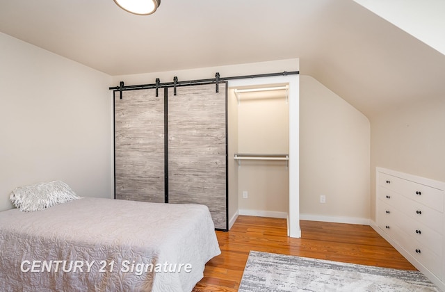 105 Parkwood Ct, Bay City, MI 48706 - bedroom with baseboards and wood finished floors